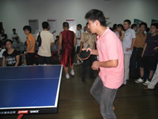 Participate in community table tennis match